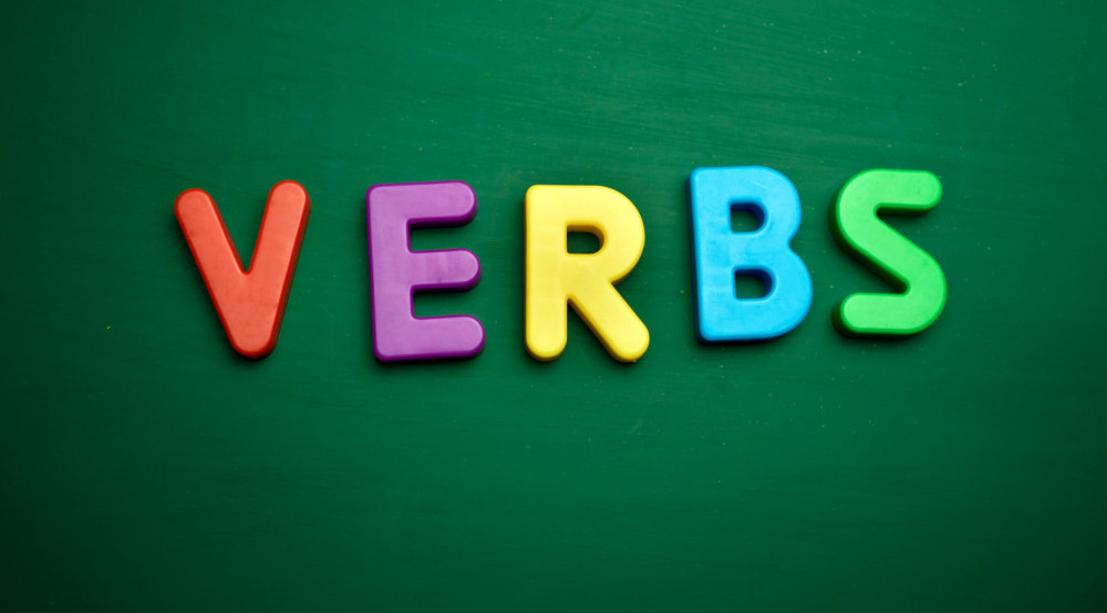 The word Verbs on a green background