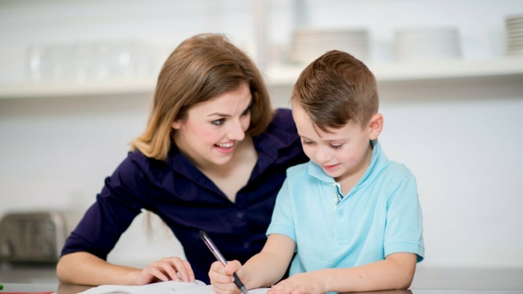 Parent supporting child studying